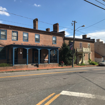 Greek Revival houses at 222, 218, and 214 Main (left to right)
