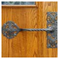 Metalwork, door handle of west entry