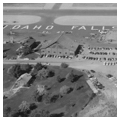 Aerial view showing beacon tower, terminal, hangar, and cabin, c. 1955