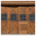 Doors to maintenance area, framed with unpeeled half logs