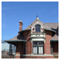 Baroque Revival brick bay with ogee dormer