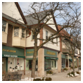 Storefronts, east elevation, north side of square