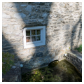 Southeast side, detail of stream entry to cellar spring