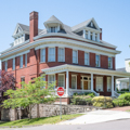 Noteworthy Queen Anne houses include one designed by Wright Butler at 400 Washington Street (1890).