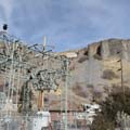 Transformers and powerhouse below, pressure box and penstocks on the hill above